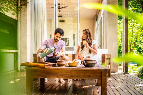 istock Young couple enjoying breakfast at home 1194209456