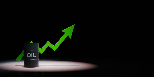 istock Oil Barrel With Rising Arrow Chart Spotlighted on Black Background 1194211110