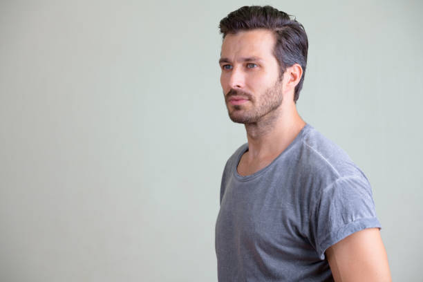 istock Studio shot of handsome bearded man thinking 1194212235