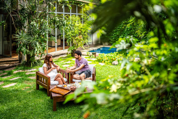 istock Young couple enjoying breakfast in the yard 1194215124
