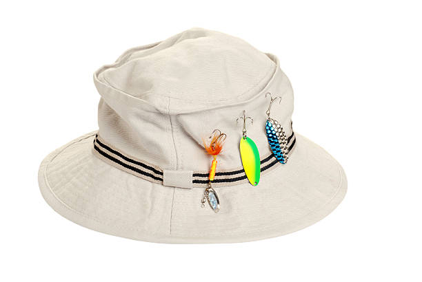 khaki hat with fishing tackle  fishing tackle stock pictures, royalty-free photos & images