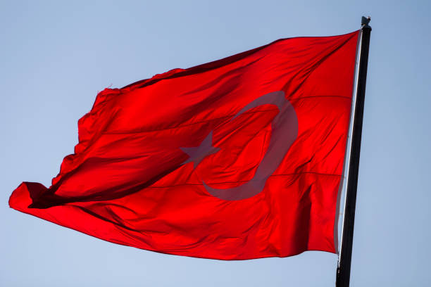 istock Turkish flag in breeze at evening sun. 1194219840