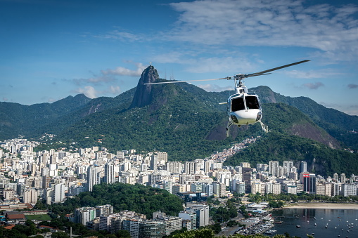 Aerial view over Rio de Janeiro, Corocvado with Helicopter in the sky