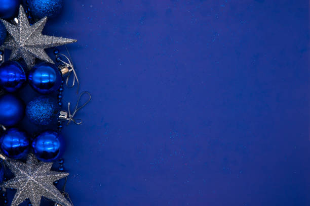 istock Christmas composition on a blue sheet with a Christmas balls and star 1194228048
