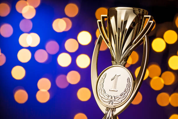 istock Championship winners award with a gold trophy 1194229117