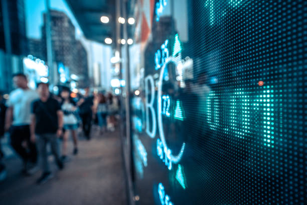 istock Display stock market numbers with graph and blurred people 1194229127