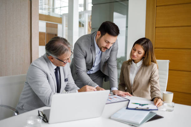 istock Senior manager getting updated by his staff 1194230501