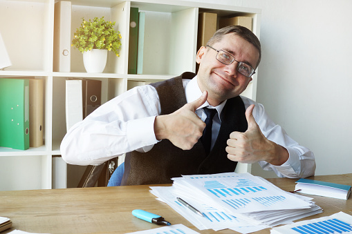 successful businessman thumbs up