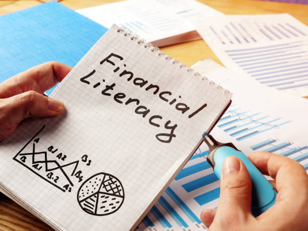 Financial literacy handwritten in the notepad. Financial literacy handwritten in the notepad. financial literacy stock pictures, royalty-free photos & images