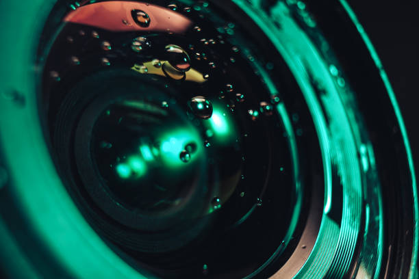 istock Close up beautiful Camera lens of drop water, aqua menthe light. Background pattern for design. Macro photography view. 1194232090