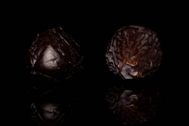 istock Dried date fruit isolated on black glass 1194232841