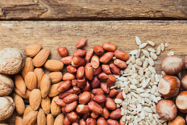 istock Mix of nuts Almonds, walnuts, peanuts, hazelnuts , sunflower seeds 1194237495