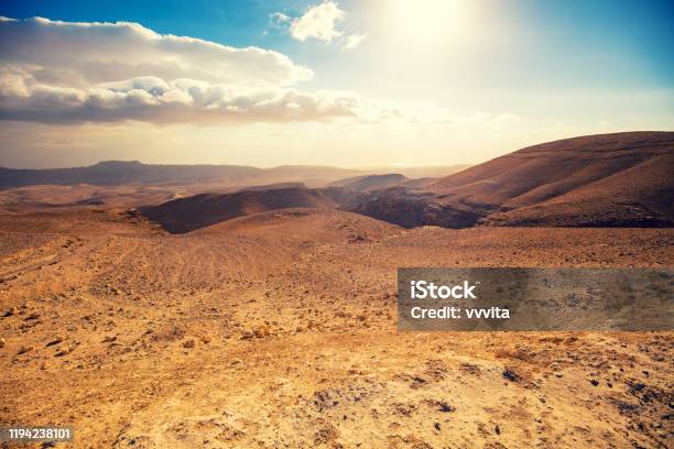 Mountainous Desert With A Beautiful Cloudy Sky Desert In Israel At Sunset Stock Photo - Download Image Now