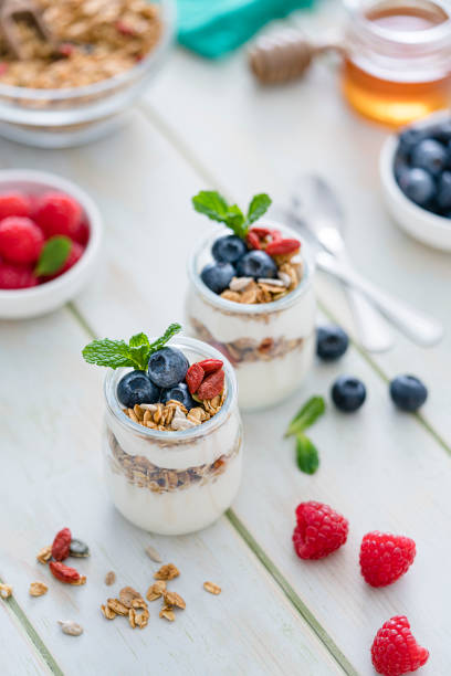 istock Healthy food: homemade yogurt with granola on breakfast table. 1194239504