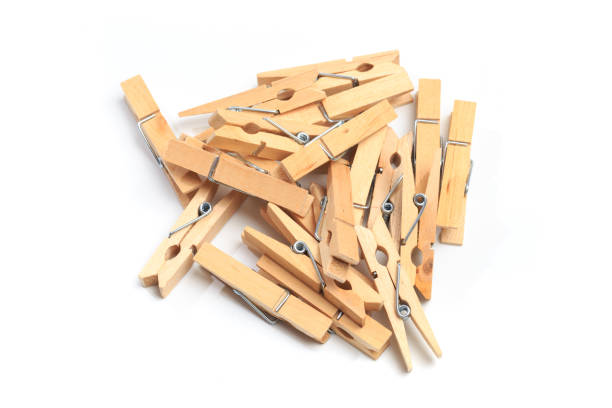 istock Brown wood clothes peg or clothespin on white background. 1194239993