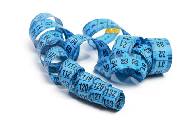 istock Blue measuring tape isolated on white background 1194239998