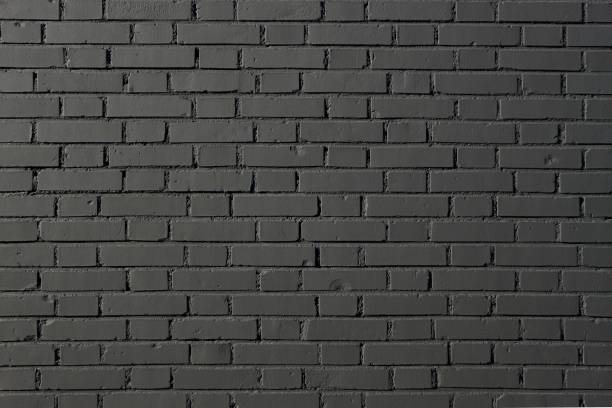 istock Grunge brick wall painted in black. Background and texture 1194240591