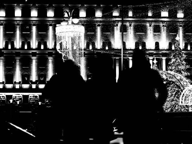 Crowded city street in the Christmas illumination. Black and white photo