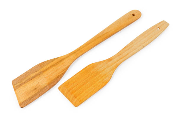 istock Two different wooden kitchen spatulas on a white background 1194243268