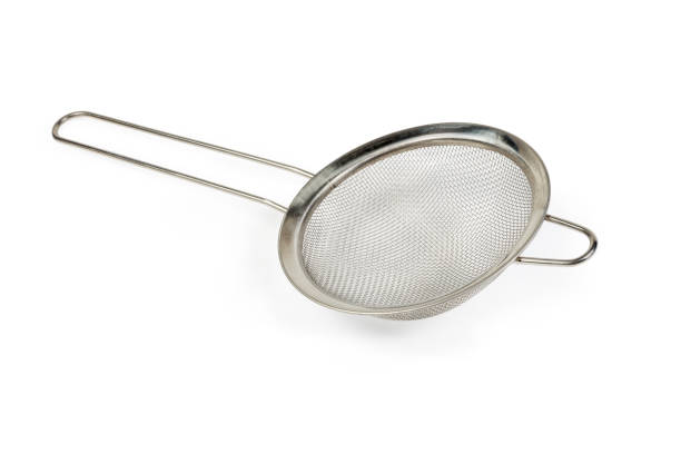 istock Round stainless steel sieve on a white background 1194243782