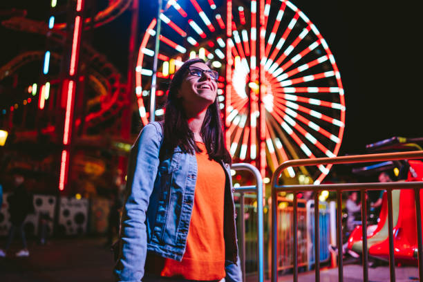 istock Cheerful woman in amusement park 1194244896