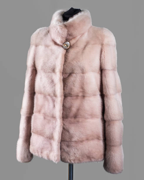 istock Short blonde mink fur coat, lady driver, made of transverse bands. Horizontal frame 1194246162