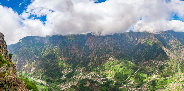 Miradouro do Curral das Freiras viewpoint with a spectaculair over the Valley of the Nuns on Madeira island, Portugal during a beautiful summer day.