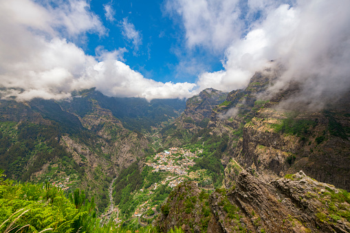 Miradouro do Curral das Freiras viewpoint with a spectaculair over the Valley of the Nuns on Madeira island, Portugal during a beautiful summer day.