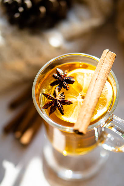 istock Hot winter drink with cinnamon and lemon on bright sunny day 1194248528