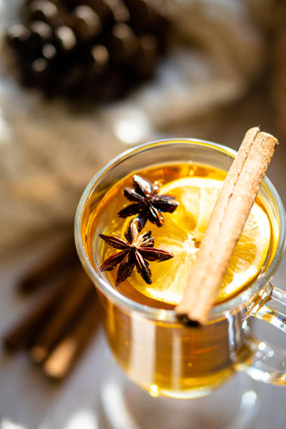 istock Hot winter drink with cinnamon and lemon on bright sunny day 1194248915