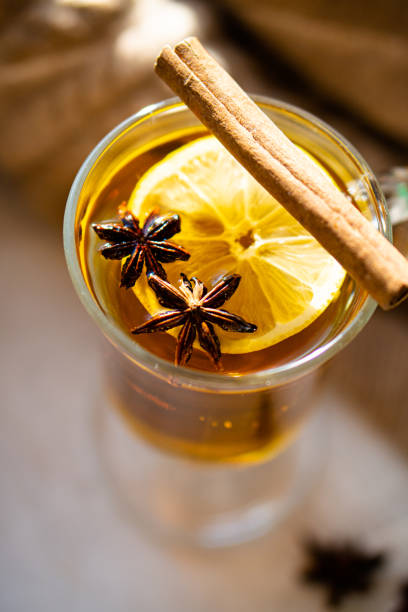 istock Hot winter drink with cinnamon and lemon on bright sunny day 1194249819