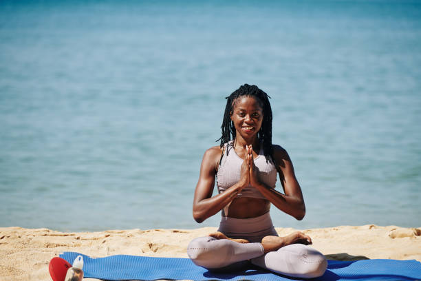 istock Happy woman showing namaste gesture 1194249896