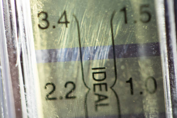 Close up of PH tester level bar which show indicator in number and present color yellow and purple shade, macro photography and blurred effect, low exposure