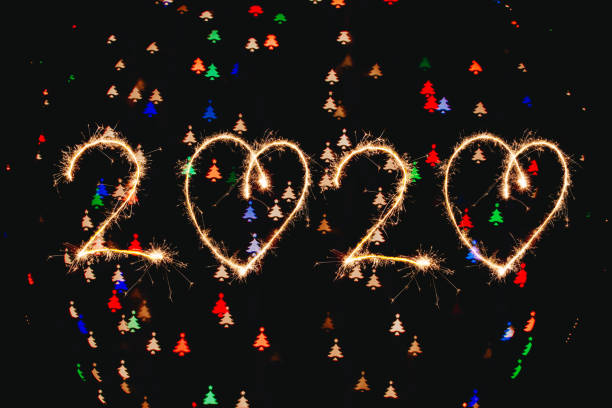 istock Lights blurred bokeh background from christmas lights. Happy new year 2020 1194250236