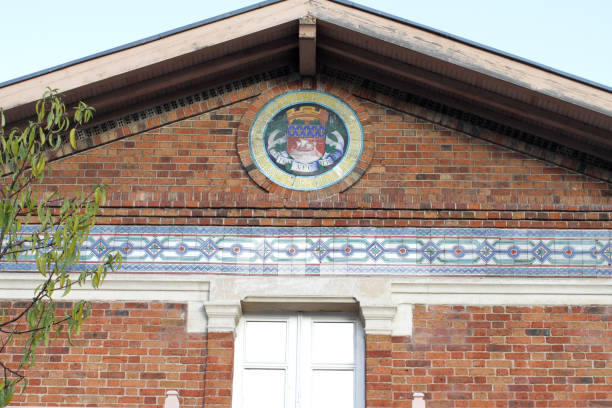 istock Paris coat of arms, Fluctuat Nec Mergitur motto, on facade 1194252576