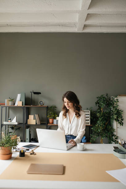 istock Pretty Businesswoman Enjoying Her Work 1194253973