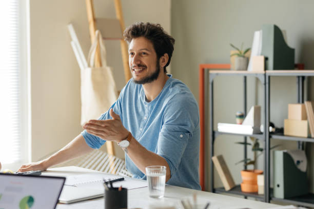 istock Young Businessman Working with a Colleague 1194254556