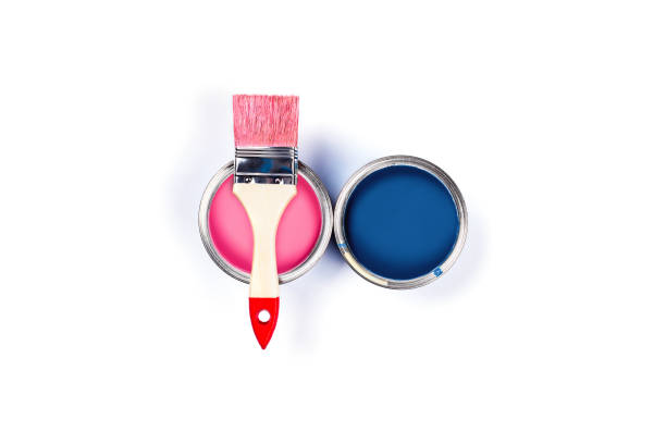 istock White background with color paint jars. 1194255376