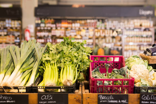 istock Showcase with various fresh vegetables in greengrocery 1194255824