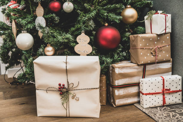 istock Decorative boxes with gifts under the Christmas tree. Winter holiday concept. 1194256832