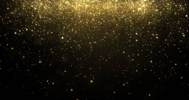 istock Gold glitter confetti particles falling, golden sparkling light shine background for Christmas holiday. Abstract magic golden glowing shimmer confetti with firework glittering sparks 1194257362