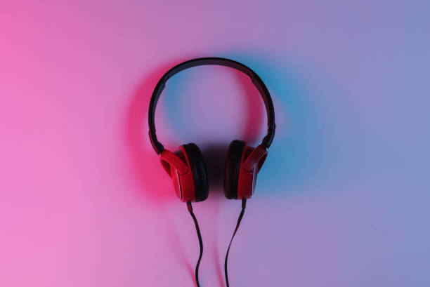 istock Wired headphone with neon blue-red gradient light. Retro wave, 80s pop culture. Top view 1194266607