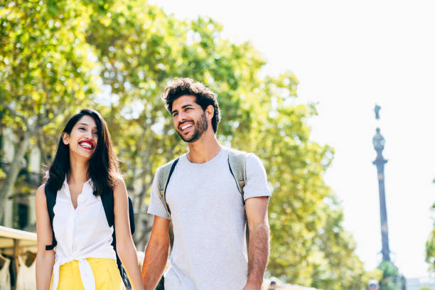 istock Relaxed young vacationers walking on La Rambla in Barcelona 1194266932