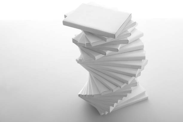 istock Stacked white books and laptop 1194267341
