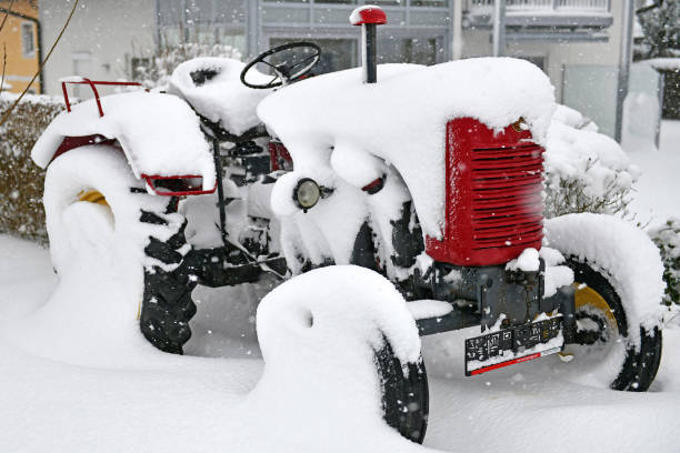 istock Tractor with a lot of snow 1194268889