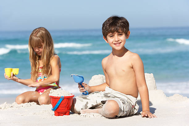istock Children Building Sandcastles On Beach Holiday 119427128