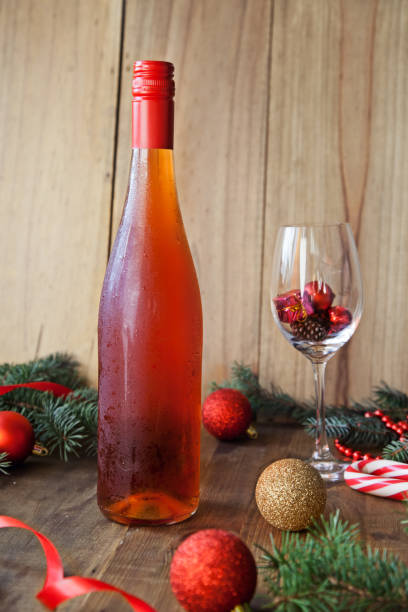 istock Wine and Christmas Decor on a wooden background 1194272104
