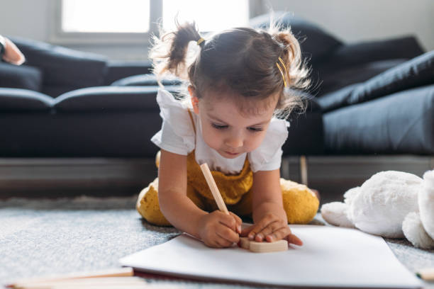Girl Drawing on the Floor