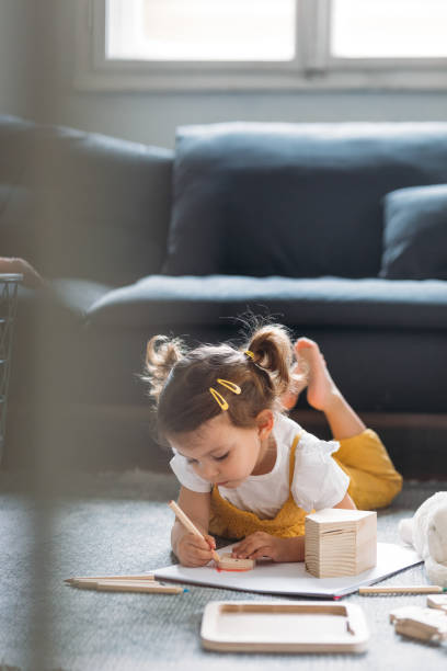 istock A Child Drawing at Home 1194274267