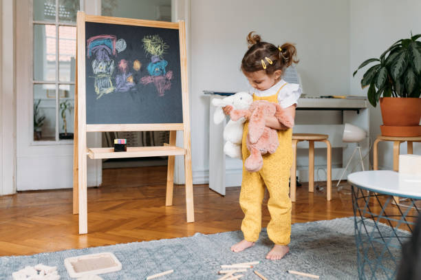 istock Cute Girl Playing with Toys 1194274270